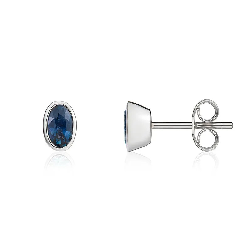 9ct White Gold Sapphire 5x3mm Oval Rub Over Set Stud Earrings