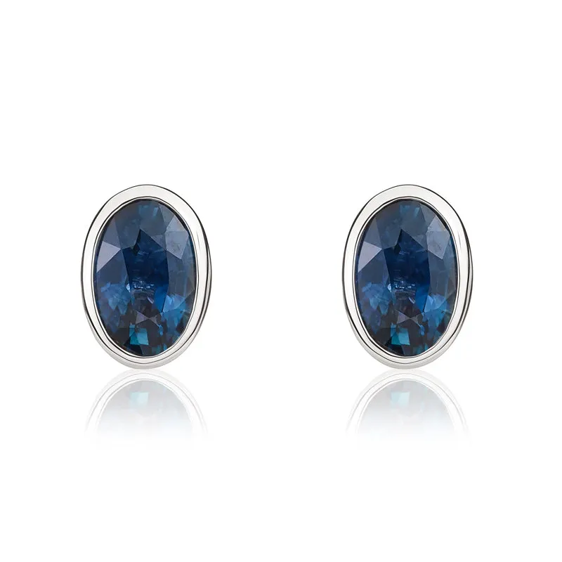 9ct White Gold Sapphire 6x4mm Oval Rub Over Set Stud Earrings