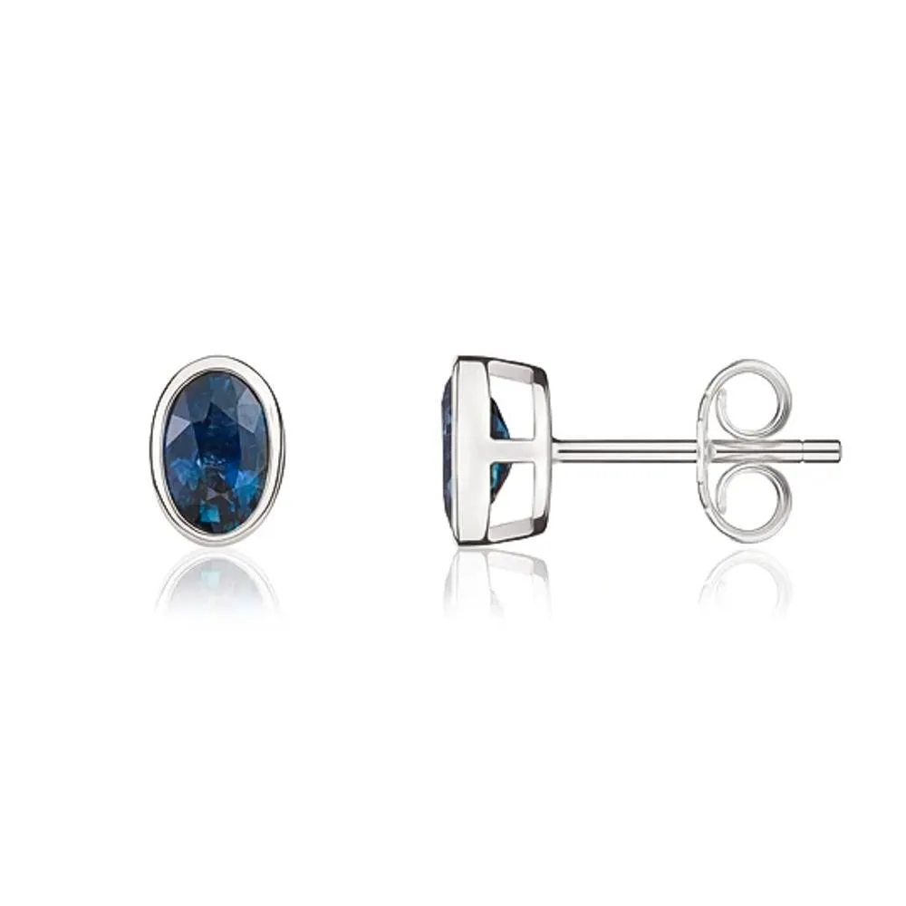 9ct White Gold Sapphire 6x4mm Oval Rub Over Set Stud Earrings