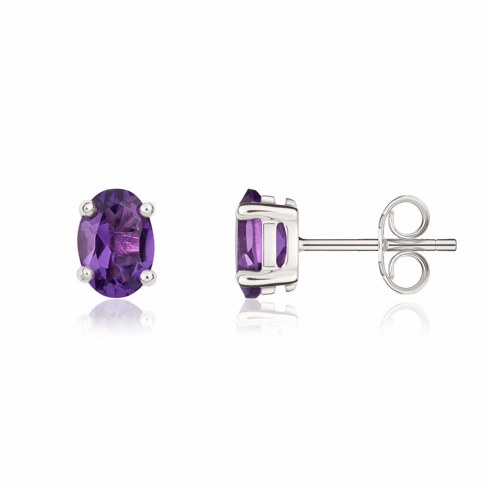 9ct White Gold Amethyst 7x5mm Oval Claw Set Stud Earrings